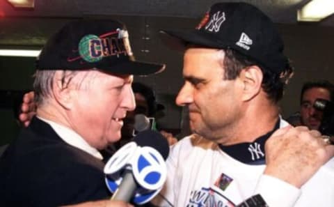 Owner George Steinbrenner and manager Joe Torre celebrate  the Yankees’ sweep of the San Diego Padres in the 1998 World Series. TIMOTHY A. CLARY/AFP via Getty Images)