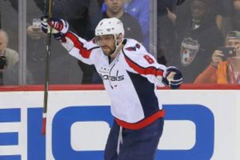 Feb 6, 2016; Newark, NJ, USA; Washington Capitals left wing Alex Ovechkin (8) celebrates his game winning goal on New Jersey Devils goalie Cory Schneider (35) (not shown) during the shootout at Prudential Center. The Capitals defeated the Devils 3-2. Mandatory Credit: Ed Mulholland-USA TODAY Sports