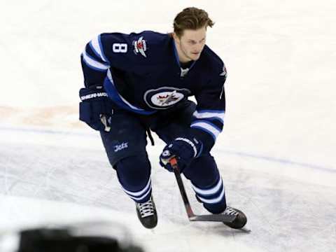 Jan 10, 2016; Winnipeg, Manitoba, CAN; Winnipeg Jets defenseman Jacob Trouba (8) warms up prior to the game against the Buffalo Sabres at MTS Centre. Mandatory Credit: Bruce Fedyck-USA TODAY Sports