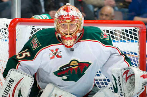 EDMONTON, CANADA – JANUARY 18: Anton Khudobin #35 of the Minnesota Wild concentrates on the puck against the Edmonton Oilers at Rexall Place on January 18, 2011 in Edmonton, Alberta, Canada. (Photo by Andy Devlin/NHLI via Getty Images)