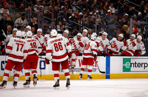 COLUMBUS, OH – OCTOBER 23: Sebastian Aho #20 of the Carolina Hurricanes is congratulated by his teammates after scoring a goal during the third period of the game against the Columbus Blue Jackets at Nationwide Arena on October 23, 2021, in Columbus, Ohio. Carolina defeated Columbus 5-1. (Photo by Kirk Irwin/Getty Images)