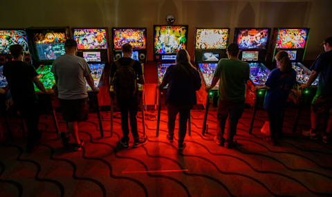 MONROEVILLE, PA – OCTOBER 02: Gamers sample an assortment of pinball machines at the Pittsburgh Gaming Expo at the Monroeville Convention Center on October 2, 2021, outside Pittsburgh, in Monroeville, Pennsylvania. (Photo by Jeff Swensen/Getty Images)