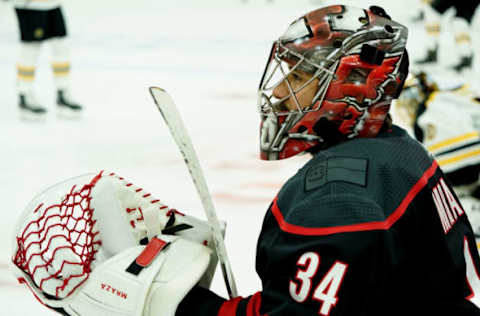 RALEIGH, NC – MAY 14: Petr Mrazek #34 of the Carolina Hurricanes prepares himself during warmups prior to Game Three of the Eastern Conference Third Round against the Boston Bruins during the 2019 NHL Stanley Cup Playoffs on May 14, 2019 at PNC Arena in Raleigh, North Carolina. (Photo by Gregg Forwerck/NHLI via Getty Images)