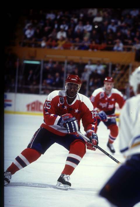 27 JANUARY 1993, REGGIE SAVAGE OF THE WASHINGTON CAPITALS WATCHES FOR THE PUCK DURING A GAME AGAINST THE BUFFALO SABRES.