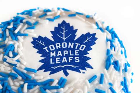 A donut decorated in white and blue with the Toronto Maple Leafs logo in the center. The hockey team was the best from Canada in the NHL. (Photo by Roberto Machado Noa/LightRocket via Getty Images)