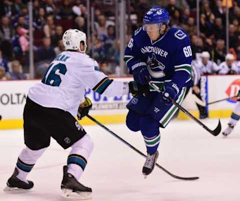 Mar 3, 2016; Vancouver, British Columbia, CAN; Vancouver Canucks forward Markus Granlund (60) jumps over the stick of San Jose Sharks defenseman Roman Polak (46) during the first period at Rogers Arena. Mandatory Credit: Anne-Marie Sorvin-USA TODAY Sports