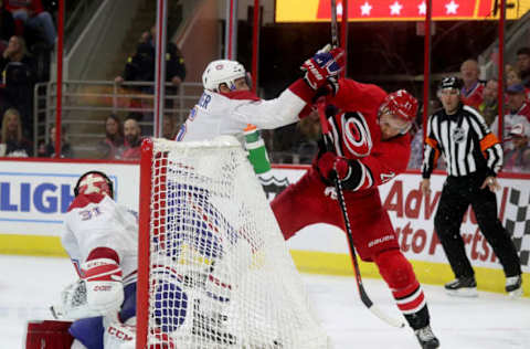 RALEIGH, NC – MARCH 24: Nino Niederreiter #21 of the Carolina Hurricanes and Shea Weber #6 of the Montreal Canadiens battle behind the net during an NHL game on March 24, 2019 at PNC Arena in Raleigh, North Carolina. (Photo by Gregg Forwerck/NHLI via Getty Images)