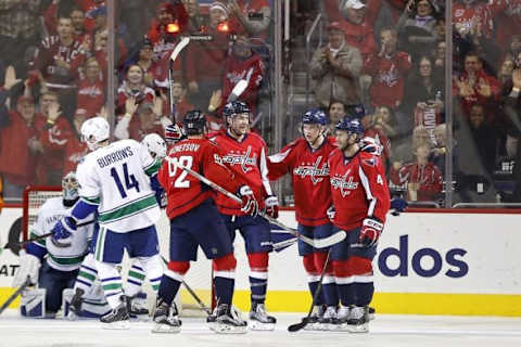 Jan 14, 2016; Washington, DC, USA; Washington Capitals right wing Tom Wilson (43) celebrates with teammates after scoring a goal against Vancouver Canucks goalie Ryan Miller (30) in the third period at Verizon Center. The Capitals won 4-1. Mandatory Credit: Geoff Burke-USA TODAY Sports