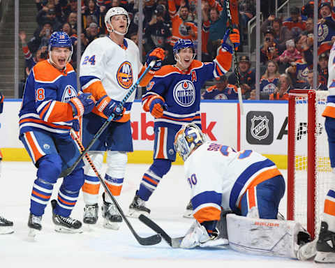 EDMONTON, CANADA – NOVEMBER 13: Zach Hyman #18 and Ryan Nugent-Hopkins #93 of the Edmonton Oilers celebrate a power-play goal against Scott Mayfield #24 and goaltender Ilya Sorokin #30 of the New York Islanders in the third period on November 13, 2023 at Rogers Place in Edmonton, Alberta, Canada. (Photo by Lawrence Scott/Getty Images)