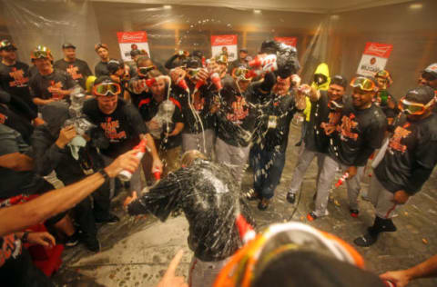 Oct 2, 2016; Bronx, NY, USA; The Baltimore Orioles spray manager Buck Showalter with champagne after beating the New York Yankees 5-2 to clinch an American League Wild Card playoff spot at Yankee Stadium. Mandatory Credit: Danny Wild-USA TODAY Sports