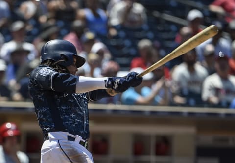 SAN DIEGO, CA – AUGUST 12: Freddy Galvis #13 of the San Diego Padres hits a grand slam during the third inning of a baseball game against the Philadelphia Phillies at PETCO Park on August 12, 2018 in San Diego, California. (Photo by Denis Poroy/Getty Images)