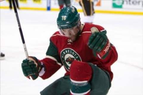 Feb 26, 2013; St. Paul, MN, USA; Minnesota Wild forward Jason Zucker (16) celebrates his goal during the third period against the Calgary Flames at the Xcel Energy Center. The Wild defeated the Flames 2-1 in overtime. Mandatory Credit: Brace Hemmelgarn-USA TODAY Sports