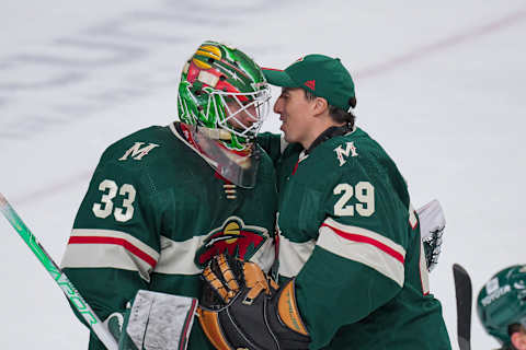 Marc-Andre Fleury, right, talks with fellow Minnesota Wild goalie Cam Talbot. (Brad Rempel-USA TODAY Sports