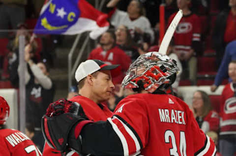 RALEIGH, NC – APRIL 04: Carolina Hurricanes Goalie Curtis McElhinney (35) and Carolina Hurricanes Goalie Petr Mrazek (34) celebrate after the Carolina Hurricanes clinch their first playoff birth since 2009 during a game between the New Jersey Devils and the Carolina Hurricanes at the PNC Arena in Raleigh, NC on April 4, 2019. (Photo by Greg Thompson/Icon Sportswire via Getty Images)