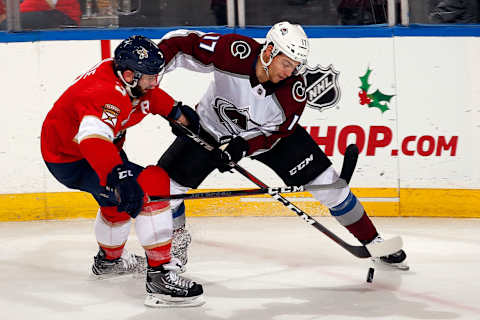 SUNRISE, FL – DECEMBER 6: Keith Yandle #3 of the Florida Panthers crosses sticks with Tyson Jost #17 of the Colorado Avalanche at the BB&T Center on December 6, 2018 in Sunrise, Florida. (Photo by Eliot J. Schechter/NHLI via Getty Images)