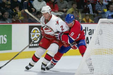 30 Jan 1999: Glen Wesley #2 of the Carolina Hurricanes is grabbed by Mark Recchi # 8 of the Montreal Canadiens at the Molson Centre In Montreal, Canada. The Hurricanes defeated the Canadiens 3-1. Mandatory Credit: Robert Laberge /Allsport