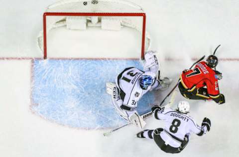 Feb 28, 2017; Calgary, Alberta, CAN; Los Angeles Kings goalie Ben Bishop (31) guards his net as Calgary Flames defenseman TJ Brodie (7) scores a goal during the overtime period at Scotiabank Saddledome. Calgary Flames won 2-1. Mandatory Credit: Sergei Belski-USA TODAY Sports