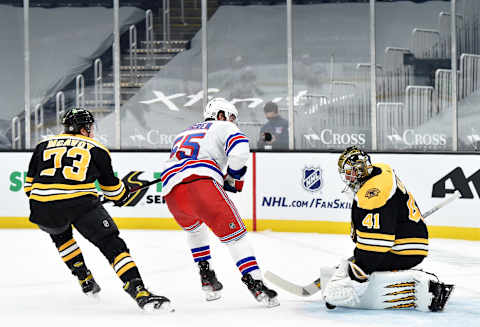 Mar 11, 2021; Boston, Massachusetts, USA; Boston Bruins goaltender Jaroslav Halak (41) makes a save on New York Rangers defenseman Ryan Lindgren (55) while defenseman Charlie McAvoy (73) during the second period at TD Garden. Mandatory Credit: Bob DeChiara-USA TODAY Sports