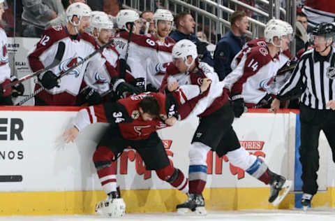 GLENDALE, AZ – DECEMBER 23: Erik Johnson #6 of the Colorado Avalanche and Zac Rinaldo #34 of the Arizona Coyotes scuffle in front of the Avalanche bench during the second period at Gila River Arena on December 23, 2017 in Glendale, Arizona. (Photo by Norm Hall/NHLI via Getty Images)