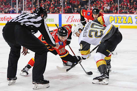 CALGARY, AB – MARCH 8: Derek Ryan #10 of the Calgary Flames faces-off against Chandler Stephenson #20 of the Vegas Golden Knights during an NHL game at Scotiabank Saddledome on March 8, 2020 in Calgary, Alberta, Canada. (Photo by Derek Leung/Getty Images)