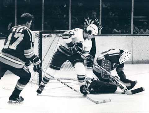 NOV 14 1981, NOV 15 1981 Ice Hockey – Colorado Rockies (Action) #17 Rocky Paul Gagne gives #60 Alie Mike Liut a hard time but Liut Puts a stop to the Puck #17 Blues Ed Kea 1 Period. Blues goalie Mike Lut smothers puck despite efforts of Rockies, Paul Gagne as Ed Kea (17) skates in to assist Liut. Credit: Denver Post (Denver Post via Getty Images)