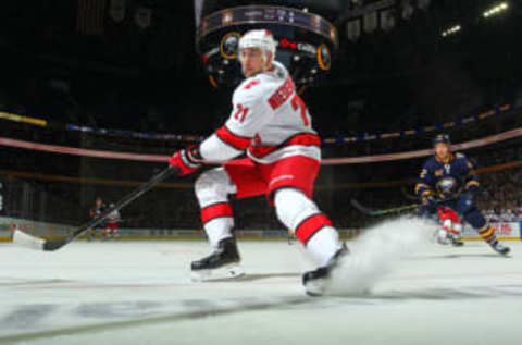 BUFFALO, NY – NOVEMBER 14: Nino Niederreiter #21 of the Carolina Hurricanes skates for the puck against the Buffalo Sabres during an NHL game on November 14, 2019 at KeyBank Center in Buffalo, New York. (Photo by Bill Wippert/NHLI via Getty Images)