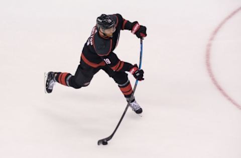 Aug 17, 2020; Toronto, Ontario, CAN; Carolina Hurricanes defenseman Dougie Hamilton (19) takes a shot during warmups prior to game four of the first round of the 2020 Stanley Cup Playoffs at Scotiabank Arena. Mandatory Credit: Dan Hamilton-USA TODAY Sports