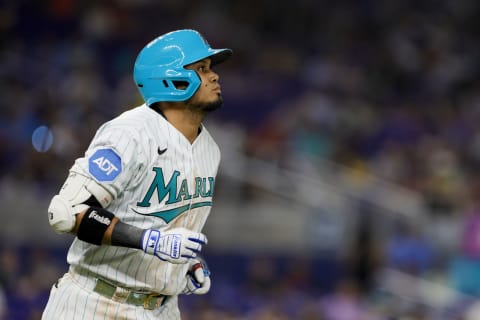 Apr 28, 2023; Miami, Florida, USA; Miami Marlins second baseman Luis Arraez (3) looks on while running toward first base after a getting walked during the seventh inning against the Chicago Cubs at loanDepot Park. Mandatory Credit: Sam Navarro-USA TODAY Sports