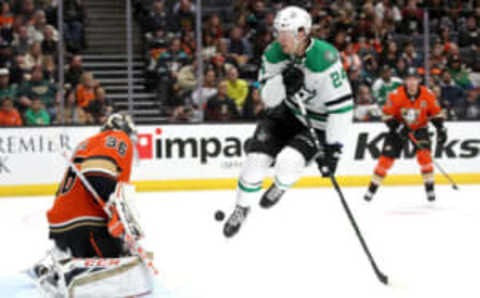 ANAHEIM, CALIFORNIA – JANUARY 09: Roope Hintz #24 of the Dallas Stars leaps to dodge a shot on goal as John Gibson #36 of the Anaheim Ducks defends during the second period of a game at Honda Center on January 09, 2020 in Anaheim, California. (Photo by Sean M. Haffey/Getty Images)