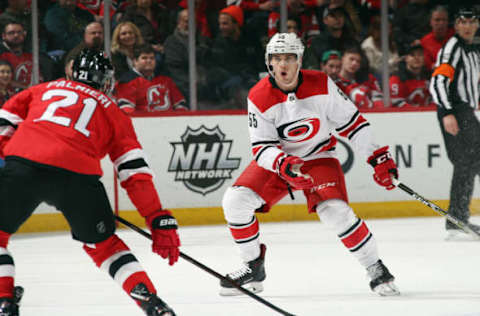 NEWARK, NJ – MARCH 27: Roland McKeown #55 of the Carolina Hurricanes defends against Kyle Palmieri #21 of the New Jersey Devils during the first period at the Prudential Center on March 27, 2018, in Newark, New Jersey. (Photo by Bruce Bennett/Getty Images)