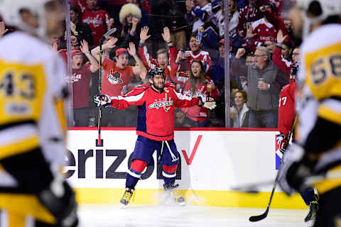 WASHINGTON, DC – JANUARY 11: Alex Ovechkin #8 of the Washington Capitals celebrates after scoring a goal for his 1000th career point against the Pittsburgh Penguins in the first period during an NHL game at Verizon Center on January 11, 2017 in Washington, DC. (Photo by Patrick McDermott/NHLI via Getty Images)