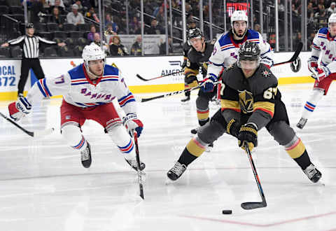 LAS VEGAS, NEVADA – DECEMBER 08: Max Pacioretty #67 of the Vegas Golden Knights skates with the puck against Tony DeAngelo #77 of the New York Rangers in the second period of their game at T-Mobile Arena on December 8, 2019 in Las Vegas, Nevada. The Rangers defeated the Golden Knights 5-0. (Photo by Ethan Miller/Getty Images)