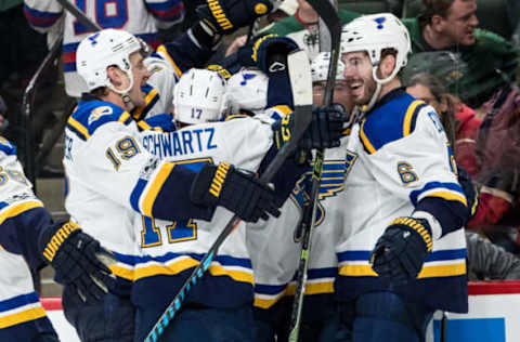 Apr 12, 2017; Saint Paul, MN, USA; St. Louis Blues defenseman Joel Edmundson (6) celebrates his game-winning goal with teammates during overtime in game one of the first round of the 2017 Stanley Cup Playoffs against the Minnesota Wild at Xcel Energy Center. The Blues defeated the Wild 2-1 in overtime. Mandatory Credit: Brace Hemmelgarn-USA TODAY Sports