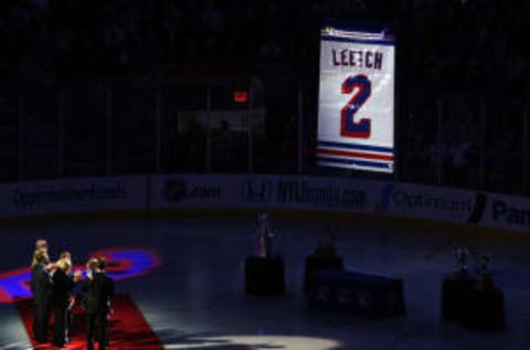 Former New York Ranger Brian Leetch watches his retired banner being raised to the rafters (Photo by Mike Stobe/Getty Images)