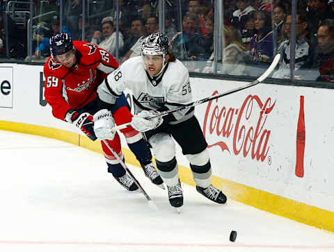 LOS ANGELES, CALIFORNIA – NOVEMBER 17: Kale Clague #58 of the Los Angeles Kings and Aliaksei Protas #59 of the Washington Capitals in the third period at Staples Center on November 17, 2021 in Los Angeles, California. (Photo by Ronald Martinez/Getty Images)