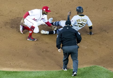 WASHINGTON, DC – APRIL 30: Washington Nationals left fielder Howie Kendrick (12) tags Pittsburgh Pirates right fielder Gregory Polanco (25) at second during a MLB game between the Washington Nationals and the Pittsburgh Pirates on April 30, 2018, at Nationals Park, in Washington, D.C.(Photo by Tony Quinn/Icon Sportswire via Getty Images)