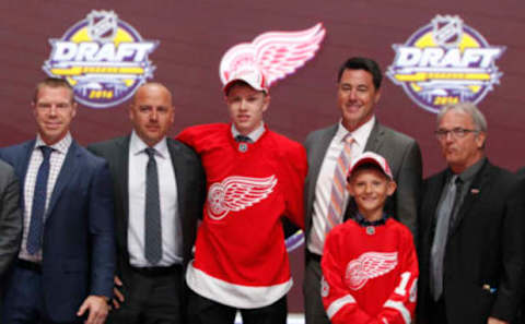 Jun 24, 2016; Buffalo, NY, USA; Dennis Cholowski poses for a photo after being selected as the number twenty overall draft pick by the Detroit Red Wings in the first round of the 2016 NHL Draft at the First Niagra Center. Mandatory Credit: Timothy T. Ludwig-USA TODAY Sports