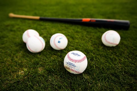 JUPITER, FL – FEBRUARY 23: Baseballs and a bat sit on the field of the Miami Marlins during a team workout on February 23, 2016 in Jupiter, Florida. (Photo by Rob Foldy/Getty Images)