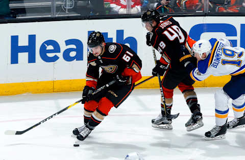 ANAHEIM, CA – JANUARY 23: Troy Terry #61 and Max Jones #49 of the Anaheim Ducks battle for the puck against Jay Bouwmeester #19 of the St. Louis Blues during the game on January 23, 2019, at Honda Center in Anaheim, California. (Photo by Debora Robinson/NHLI via Getty Images)