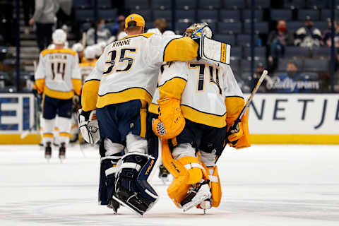 Juuse Saros #74 of the Nashville Predators is congratulated by Pekka Rinne #35 . (Photo by Kirk Irwin/Getty Images)