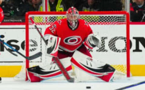 Apr 25, 2023; Raleigh, North Carolina, USA; Carolina Hurricanes goaltender Antti Raanta (32) watches a shot against the New York Islanders during the third period in game five of the first round of the 2023 Stanley Cup Playoffs at PNC Arena. Mandatory Credit: James Guillory-USA TODAY Sports