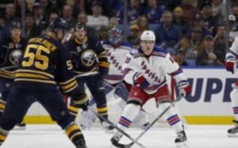 Dec 1, 2016; Buffalo, NY, USA; New York Rangers right wing Jesper Fast (19) watches as Buffalo Sabres defenseman Rasmus Ristolainen (55) looks to take a shot during the third period at KeyBank Center. Mandatory Credit: Timothy T. Ludwig-USA TODAY Sports