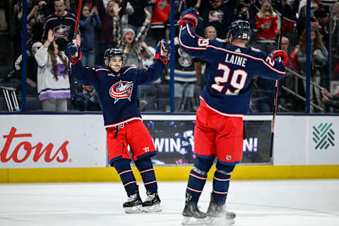 Dec 11, 2022; Columbus, Ohio, USA; Columbus Blue Jackets left wing Johnny Gaudreau (13) celebrates his game winning goal against the Los Angeles Kings with Columbus Blue Jackets left wing Patrik Laine (29) in overtime at Nationwide Arena. Mandatory Credit: Gaelen Morse-USA TODAY Sports