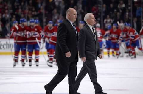 Nov 13, 2014; Montreal, Quebec, CAN; Boston Bruins head coach Claude Julien and assistant coach Doug Jarvis leave the ice while the Montreal Canadiens celebrate their 5-1 victory at the Bell Centre. Mandatory Credit: Eric Bolte-USA TODAY Sports