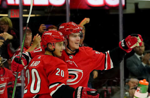 RALEIGH, NC – OCTOBER 26: Andrei Svechnikov #37 of the Carolina Hurricanes celebrates with teammate Sebastian Aho #20 after scoring a goal during an NHL game against the Chicago Blackhawks on October 26, 2019 at PNC Arena in Raleigh North Carolina. (Photo by Gregg Forwerck/NHLI via Getty Images)