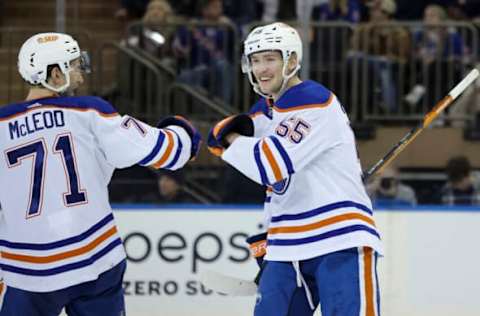 Nov 26, 2022; New York, New York, USA; Edmonton Oilers left wing Dylan Holloway (55) celebrates with Edmonton Oilers center Ryan McLeod (71) after Holloway’s goal against the Edmonton Oilers during the third period at Madison Square Garden. Mandatory Credit: Jessica Alcheh-USA TODAY Sports