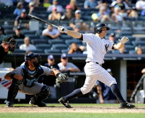 Sep 11, 2016; Bronx, NY, USA; New York Yankees left fielder Brett Gardner (11) hits an RBI single against the Tampa Bay Rays during the seventh inning at Yankee Stadium. The Rays won 4-2. Mandatory Credit: Andy Marlin-USA TODAY Sports