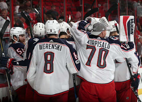 RALEIGH, NC – OCTOBER 10: The Columbus Blue Jackets celebrate their 2-1 victory over the Carolina Hurricanes following an overtime goal by Sonny Milano during of an NHL game on October 10, 2017 at PNC Arena in Raleigh, North Carolina. (Photo by Gregg Forwerck/NHLI via Getty Images)