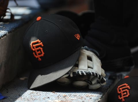 Jul 14, 2019; Milwaukee, WI, USA; San Francisco Giants hat and glove in the dug out at Miller Park. Mandatory Credit: Michael McLoone-USA TODAY Sports