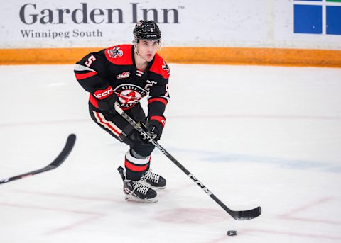 WINNIPEG, CANADA – JANUARY 21: Denton Mateychuk #5 of the Moose Jaw Warriors plays the puck during first period action against the Winnipeg ICE at Wayne Fleming Arena on January 21, 2023 in Winnipeg, Manitoba, Canada. (Photo by Jonathan Kozub/Getty Images)